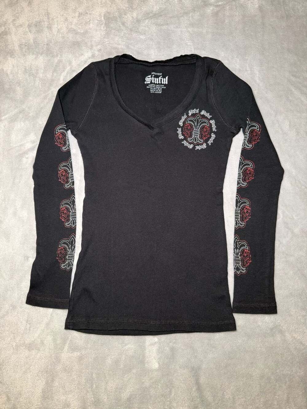 Sinful Women's Y2K Black Ribbed Long Sleeve VNeck Graphic Tee Fleur-de-lis Print